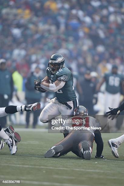 Duce Staley of the Philadelphia Eagles runs with the ball during a game against the Tampa Bay Buccaneers on January 19, 2003 at Veteran's Stadium in...