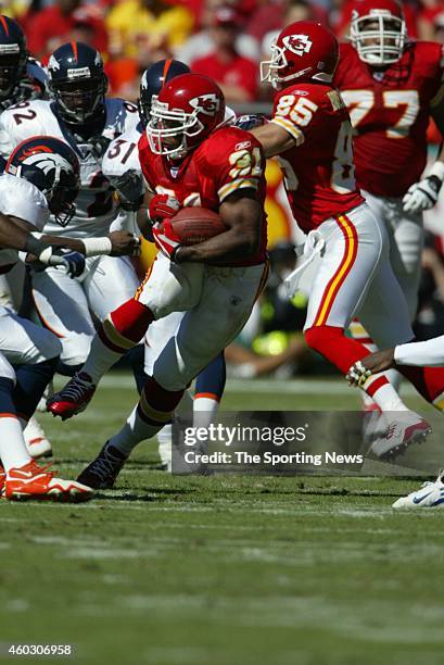 Priest Holmes of the Kansas City Chiefs runs with the ball during a game against the Denver Broncos on October 5, 2003 at Arrowhead Stadium in Kansas...