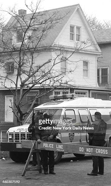 Members of Emergency Service police outside home of witness Arjune in Queens. Two cops guard him night and day. Cops, flush with success over the...