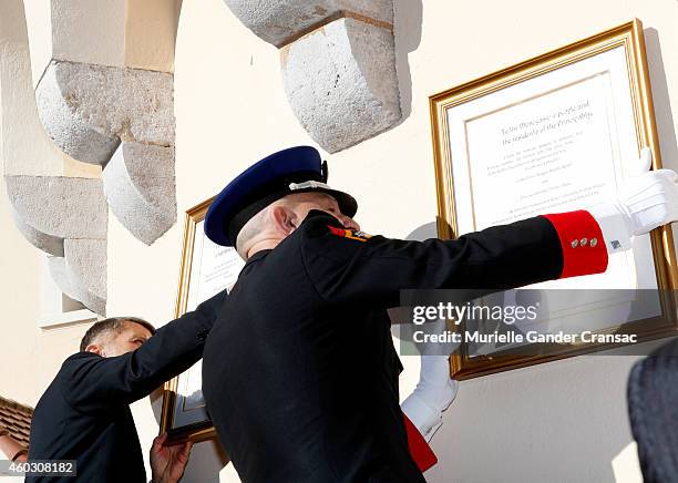 Colonel Luc Frigan and Chamberlain Laurent Soler place the official announcement of the birth of the royal twins Prince Jacques and Princess...