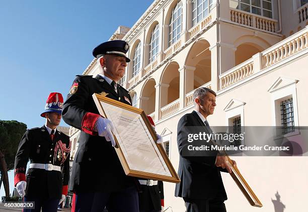 Colonel Luc Frigan and Chamberlain Laurent Soler carry the official announcement of the birth of the royal twins Prince Jacques and Princess...