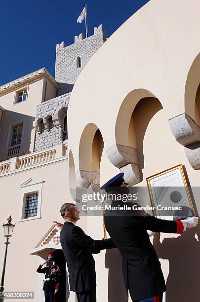 Colonel Luc Frigan and Chamberlain Laurent Soler place the official announcement of the birth of the royal twins Prince Jacques and Princess...