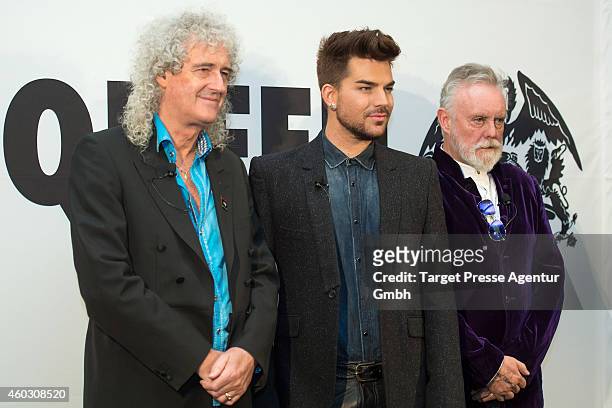 Brian May, Adam Lambert and Roger Taylor attends the Queen and Adam Lambert photocall at Ritz Carlton on December 11, 2014 in Berlin, Germany.