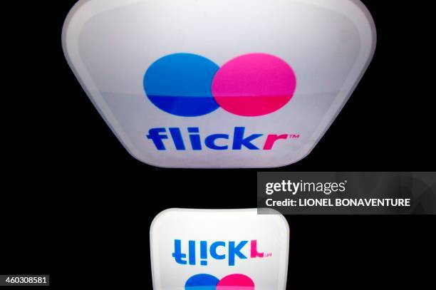 The logo of the Flickr website is displayed on a tablet on January 2, 2014 in Paris. AFP PHOTO / LIONEL BONAVENTURE