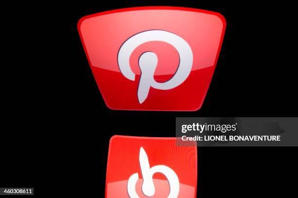 The logo of mobile app "Pinterest" is displayed on a tablet on January 2, 2014 in Paris. AFP PHOTO / LIONEL BONAVENTURE
