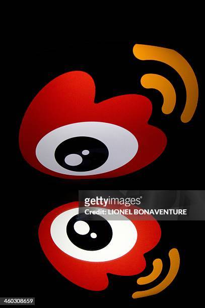 The chinese app Weibo's logo is displayed on a tablet on January 2, 2014 in Paris. AFP PHOTO / LIONEL BONAVENTURE