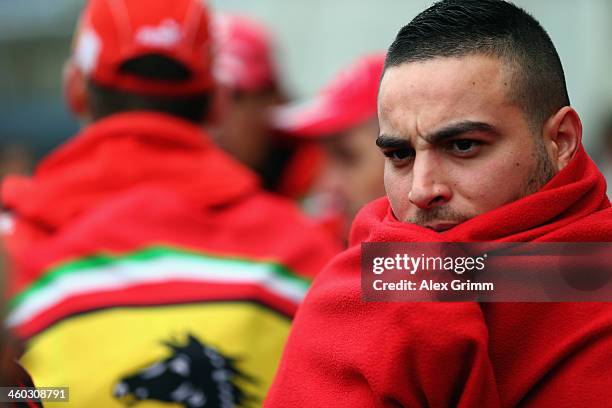 Fans gather outside the Grenoble University Hospital Centre to mark the 45th birthday of former German Formula One driver Michael Schumacher who is...