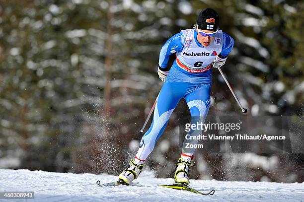 Anne Kylloenen of Finland takes 3rd place during the FIS Cross-Country World Cup Tour de Ski Women's Pursuit on January 03, 2014 in Cortina-Toblach,...