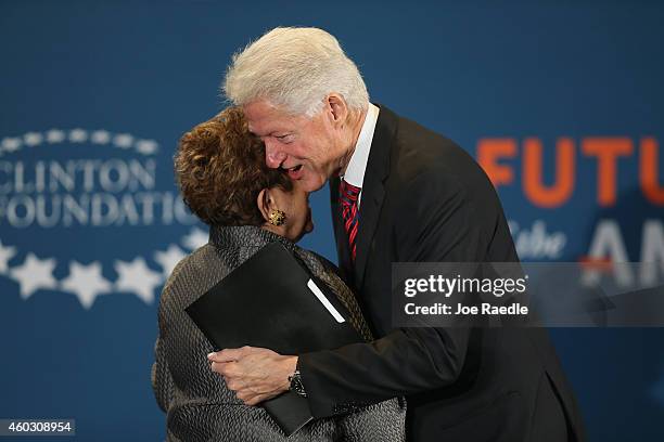 Donna Shalala, President, University of Miami greets Former President Bill Clinton as he arrives on stage during Clinton Foundations Future of the...