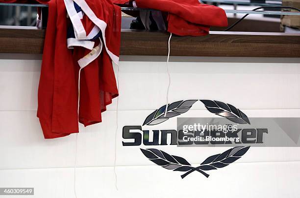 Logo sits on Sunseeker International Ltd.'s stand, a unit of China's Dalian Wanda Group, ahead of the 2014 London Boat Show at the ExCeL center in...