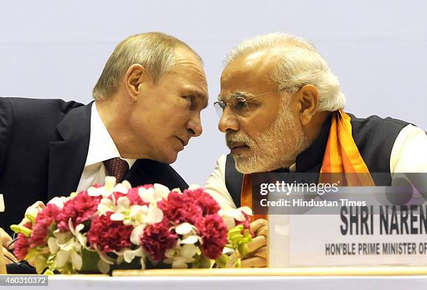 Indian Prime Minister Narendra Modi talking with Russian President Vladimir Putin during the inauguration of the World Diamond Conference at Vigyan...