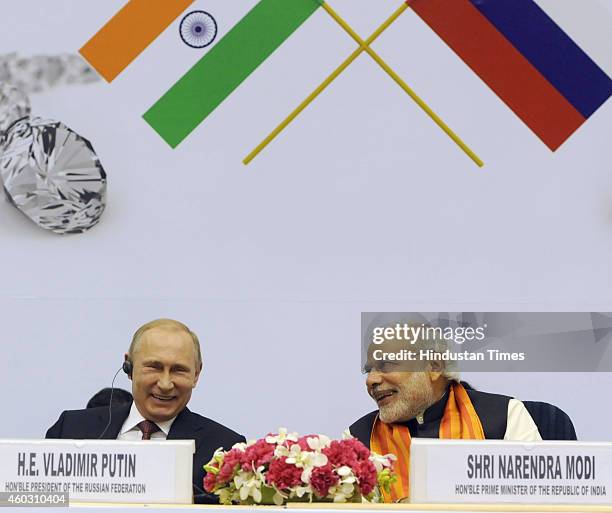 Indian Prime Minister Narendra Modi talking with Russian President Vladimir Putin during the inauguration of the World Diamond Conference at Vigyan...