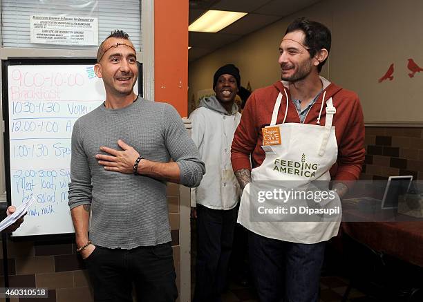 Chef Marc Forgione and tv personality Gabriele Corcos attend Feeding America Hosts Bi-Coastal Celebrity Volunteer Event at the Food Bank For New York...