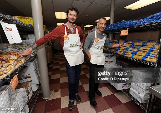 Personality Gabriele Corcos and chef Marc Forgione attend Feeding America Hosts Bi-Coastal Celebrity Volunteer Event at the Food Bank For New York...