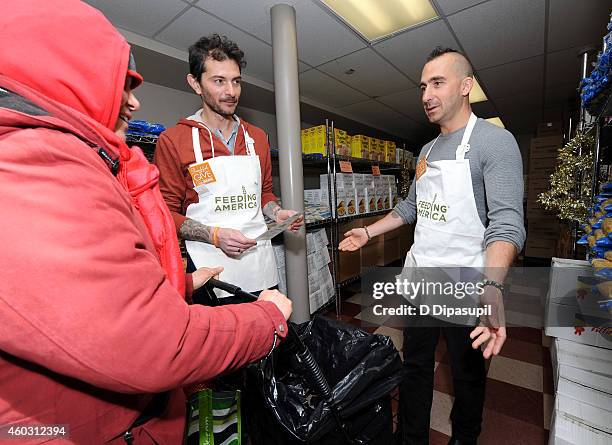 Personality Gabriele Corcos and chef Marc Forgione attend Feeding America Hosts Bi-Coastal Celebrity Volunteer Event at the Food Bank For New York...