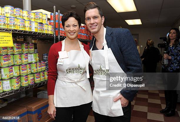 Personality Ellie Krieger and singer-songwriter Andy Grammer attend Feeding America Hosts Bi-Coastal Celebrity Volunteer Event at the Food Bank For...