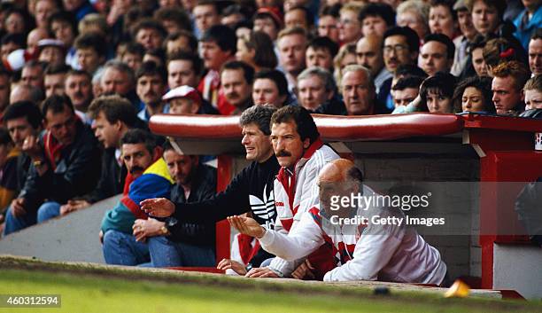 Liverpool manager Graeme Souness with backroom staff Phil Boersma and Ronnie Moran in the Anfield dug out during a match circa 1991 in Liverpool,...