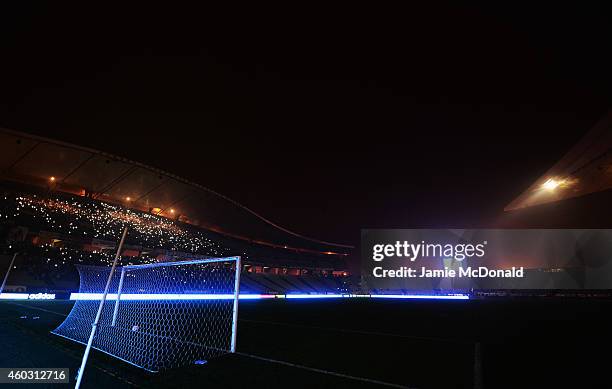 Fans shine lights from mobile phones as play is suspended following a floodlight failure during the UEFA Europa League Group C match between Besiktas...
