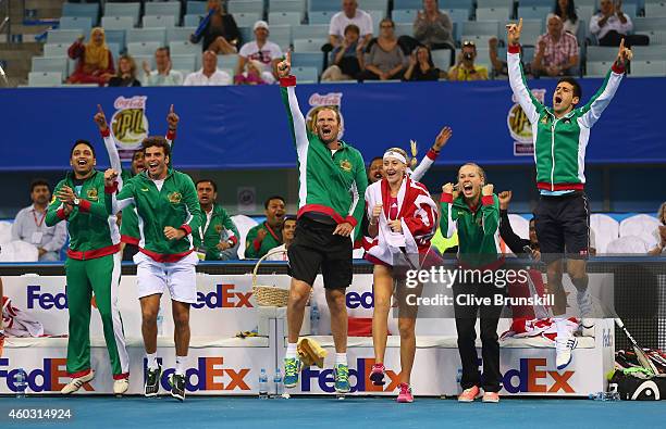 Novak Djokovic,Caroline Wozniacki,Kristina Mladenovic,John Leffine De Jager and the team bench of the UAE Royals all celebrate as team mates Nenad...