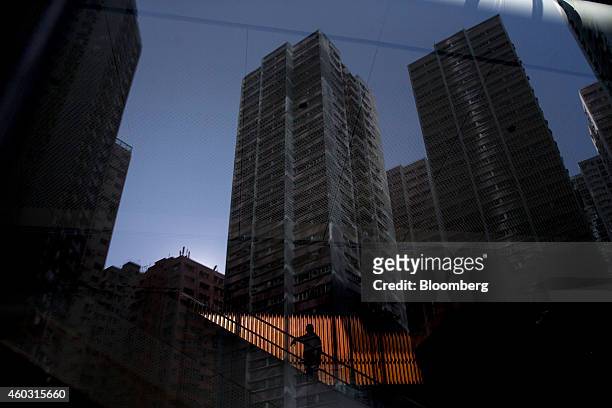 Bloomberg's Best Photos 2014: Residential buildings are reflected on the facade of the One Island East building at Taikoo Place, operated by Swire...