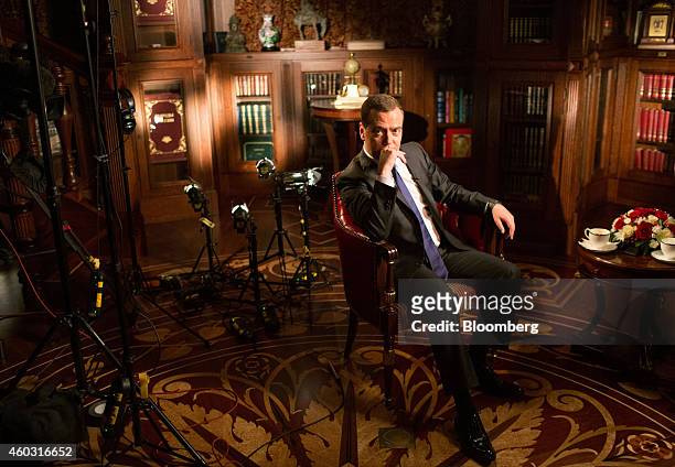 Bloomberg's Best Photos 2014: Dmitry Medvedev, Russia's prime minister, pauses during a Bloomberg Television interview at his residence in Gorki,...