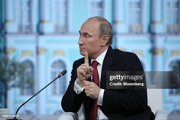 Bloomberg's Best Photos 2014: Vladimir Putin, Russia's president, speaks during the plenary session of the St. Petersburg International Economic...