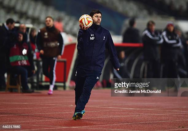 Mauricio Pochettino manager of Spurs holds the match ball during the UEFA Europa League Group C match between Besiktas JK and Tottenham Hotspur FC at...