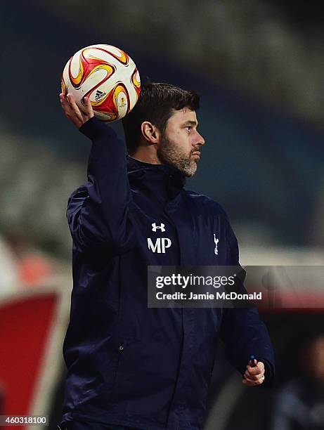 Mauricio Pochettino manager of Spurs holds the match ball during the UEFA Europa League Group C match between Besiktas JK and Tottenham Hotspur FC at...