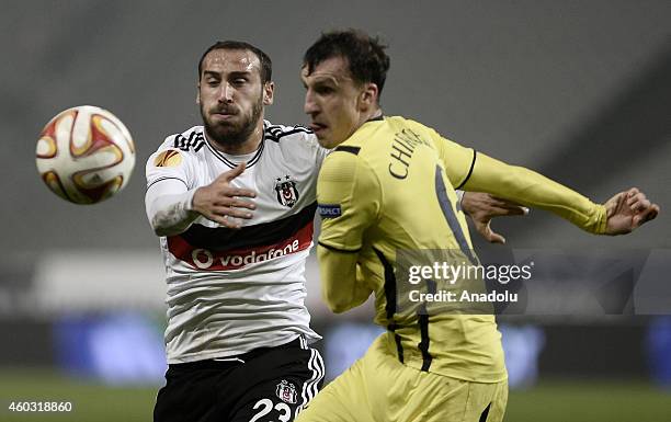 Vlad Chiriches of Tottenham Hotspur vies for the ball with Cenk Tosun of Besiktas during the UEFA Europa League Group C match between Besiktas JK and...