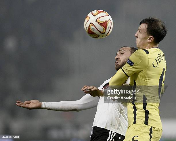 Vlad Chiriches of Tottenham Hotspur vies for the ball with Cenk Tosun of Besiktas during the UEFA Europa League Group C match between Besiktas JK and...