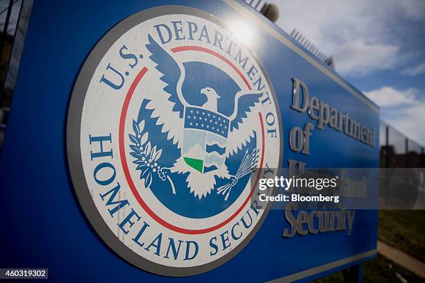 Department of Homeland Security sign stands at the agency's headquarters in Washington, D.C., U.S., on Thursday, Dec. 11, 2014. The U.S. House is set...