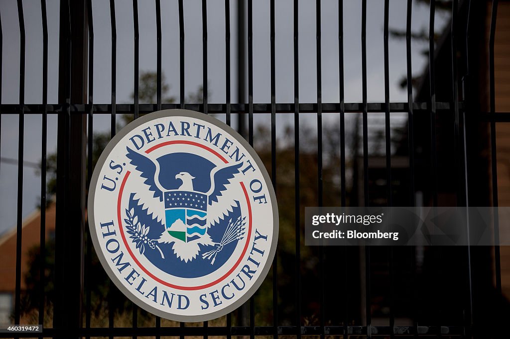 Secdhs The U.S. Department of Homeland Security seal hangs on a fence at the ...