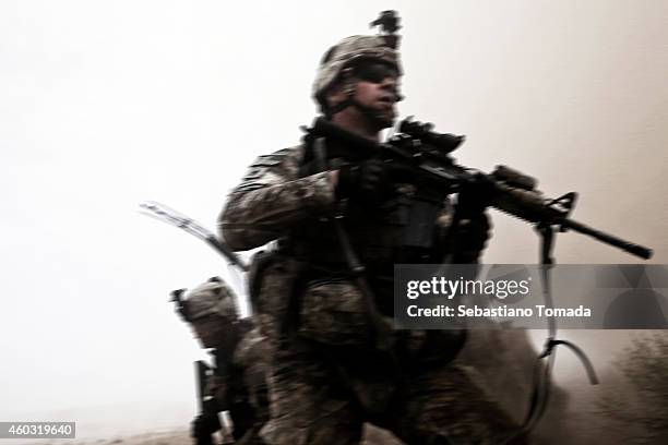 Army soldiers from 1st Battalion, 320th Field Artillery Regiment, 2nd Brigade Combat Team of the 101st react to a Taliban attack. The International...