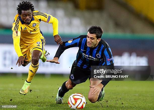 Helsinki's Anthony Annan and Brugge's Fernando Menegazzo vie for the ball during UEFA Europa League group B football match between Club Brugge and...