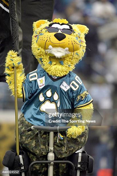 Jacksonville Jaguars mascot Jaxson DeVille holds a team flag on the field during a game against the Indianapolis Colts on November 9, 2003 at the...