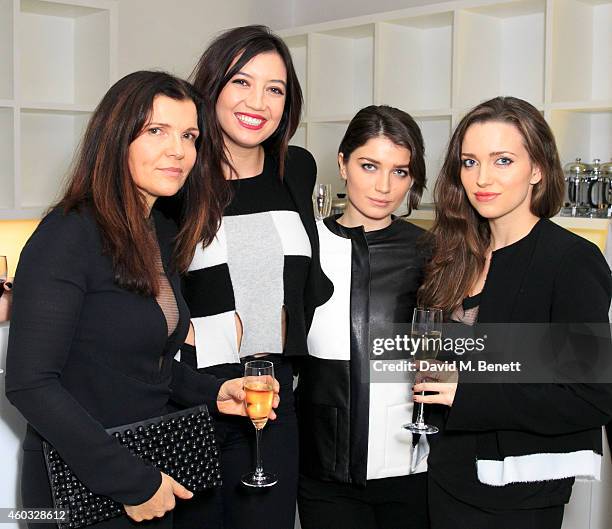 Ali Hewson, Daisy Lowe Eve Hewson and Jordan Hewson attend the Edun Pre Fall Dinner at Alison Jacques Gallery on December 11, 2014 in London, England.