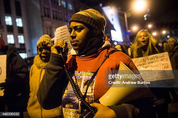 Erica Garner, daughter of Eric Garner, leads a march of people protesting the Staten Island, New York grand jury's decision not to indict a police...