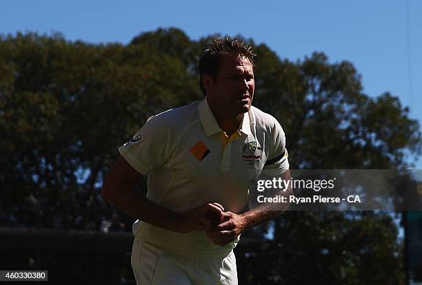 Ryan Harris of Australia warms up during day four of the First Test match between Australia and India at Adelaide Oval on December 12, 2014 in...