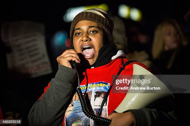 Erica Garner, daughter of Eric Garner, leads a march of people protesting the Staten Island, New York grand jury's decision not to indict a police...