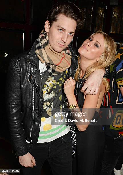 George Craig and Kara Rose Marshall attend the Glam Rock Christmas party to celebrate the collaboration between House of Hackney and Terry De...