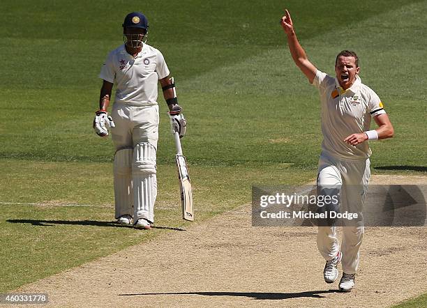 Peter Siddle kisses celebrates bowling out Karn Sharma of India during day four of the First Test match between Australia and India at Adelaide Oval...