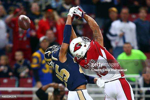 Michael Floyd of the Arizona Cardinals miss a pass in the first quarter against T.J. McDonald of the St. Louis Rams during their game at Edward Jones...