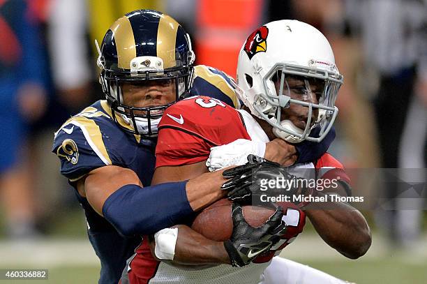 McDonald of the St. Louis Rams tackles Kerwynn Williams of the Arizona Cardinals in the second quarter during their game at Edward Jones Dome on...