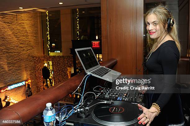 Chelsea Leyland spins at the Tommy Hilfiger and GQ event honoring The Men Of New York at the Tommy Hilfiger Fifth Avenue Flagship on December 11,...