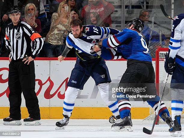 Team captains Andrew Ladd of the Winnipeg Jets and Gabriel Landeskog of the Colorado Avalanche engage in a fight resulting in penalties in the second...