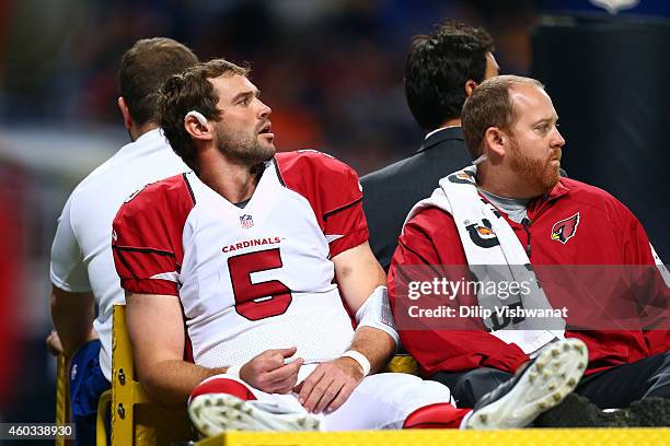 Drew Stanton of the Arizona Cardinals gets carted off the field after getting injured on a sack by Aaron Donald of the St. Louis Rams in the third...