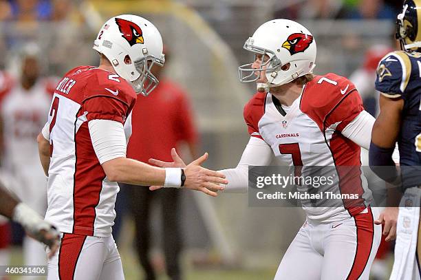 Chandler Catanzaro of the Arizona Cardinals celebrates with Drew Butler after kicking a field goal in the fourth quarter against the St. Louis Rams...