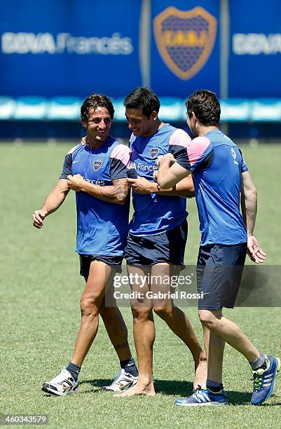 Hernan Grana, Claudio Perez and Agustin Orion of Boca Juniors leave the field after a Boca Juniors training session at Casa Amarilla on january 03,...