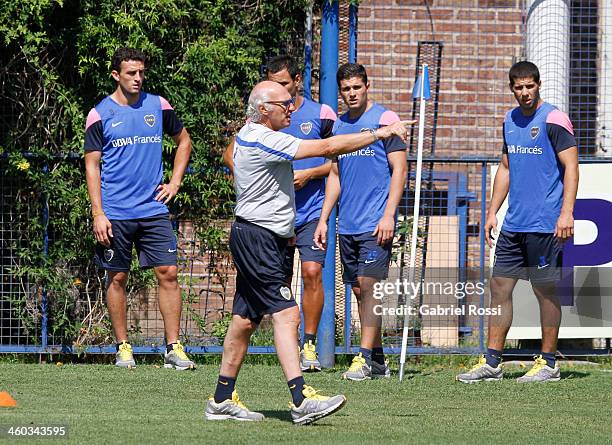 Carlos Bianchi coach of Boca Juniors speaks to his players during a Boca Juniors training session at Casa Amarilla on january 03, 2014 in Buenos...