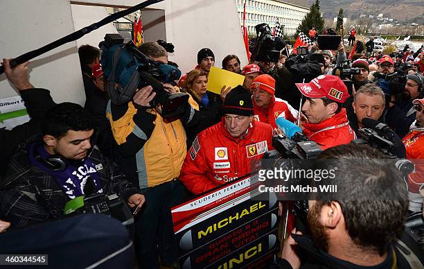 Fans try to enter Grenoble University Hospital Centre where former German Formula One driver Michael Schumacher is being treated for a severe head...